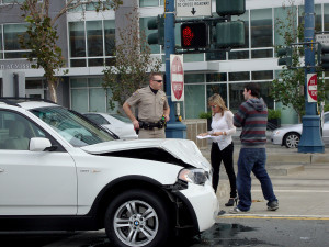 Highway Patrol Police Office Assist People After Their White Bmw