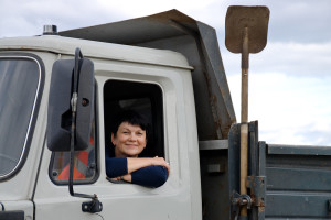 woman behind the wheel of a truck