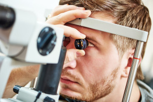 Ophthalmology concept. Male patient under eye vision examination